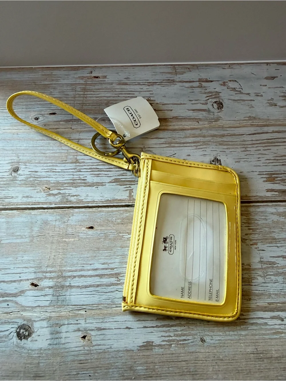 Coach wristlet Buttercup Yellow Signature Embossed Wristlet NWT